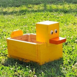 Handmade indoor/outdoor storage rubber duck or planter.